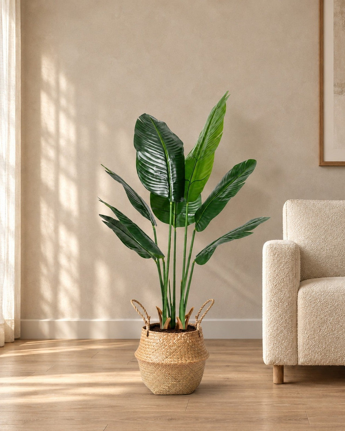 Medium seagrass belly basket with an artificial bird of paradise
