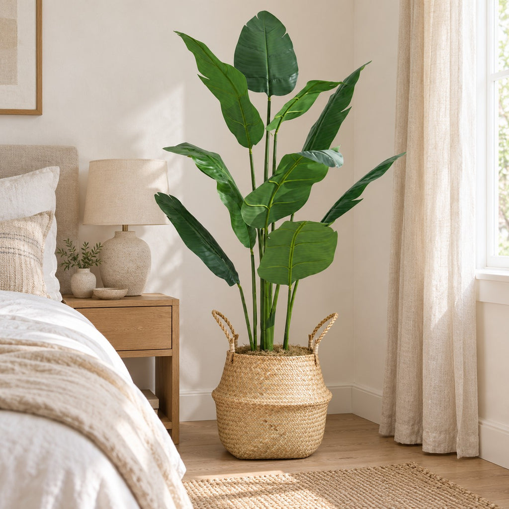 Artificial Bird of Paradise in a seagrass belly basket, styled in a real home