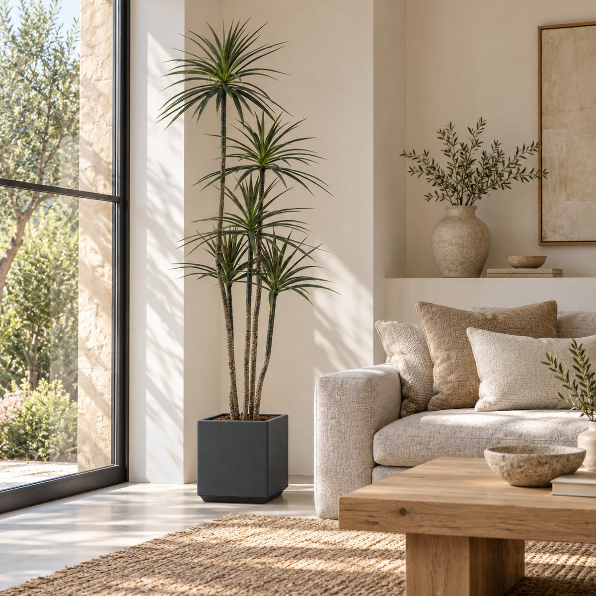 Artificial Dracaena in a grey square planter, styled in a real home