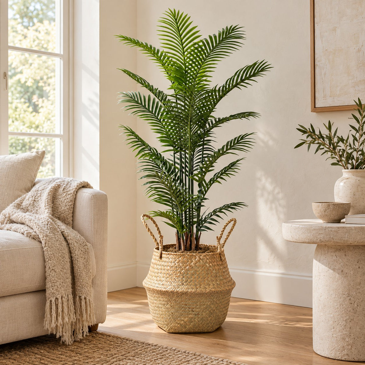 Seagrass Belly Basket with an artificial plant, styled in a real home